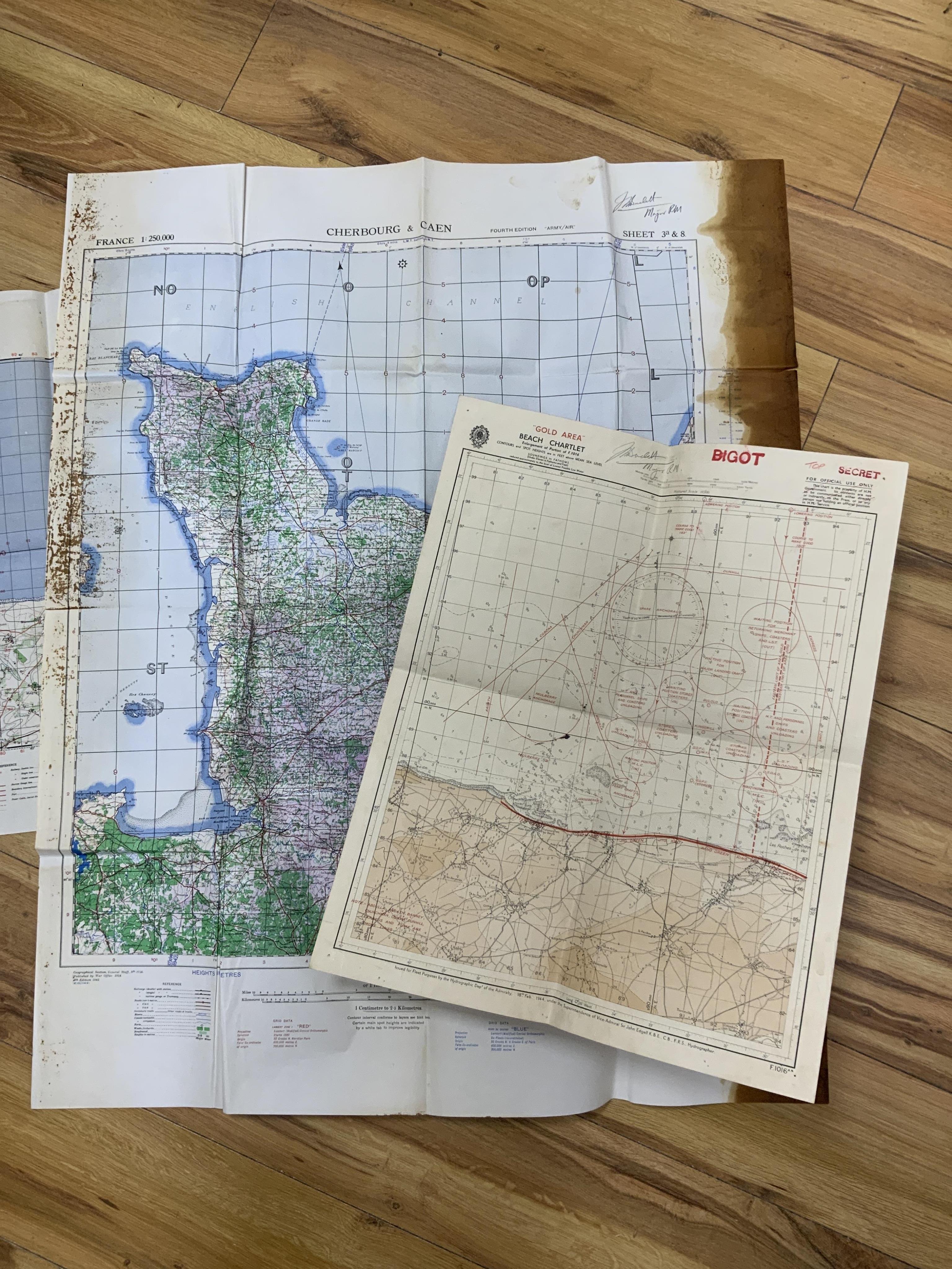 WWII D-Day and Operation Neptune related interest; an archive of mainly naval documents, maps and photographs relating to the invasion of Juno beach, 6 June 1944, comprising; the personal papers, maps, and other document
